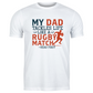 White t-shirt with colourful text and graphic on a white background, with the Cows Corner slogan saying My dad tackles life like a rugby match - head first.