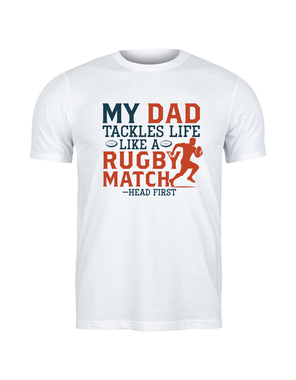 White t-shirt with colourful text and graphic on a white background, with the Cows Corner slogan saying My dad tackles life like a rugby match - head first.
