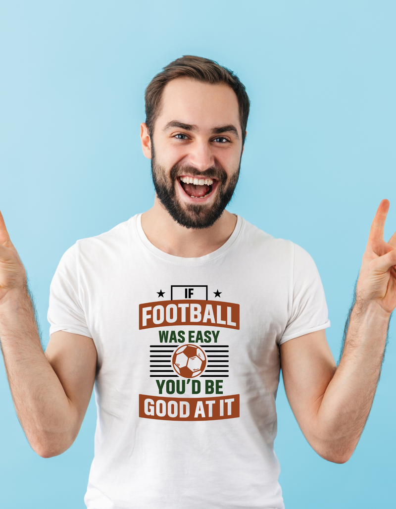 A man wearing a white T-shirt with the funny football slogan on the front that reads 'If Football Was Easy You’d Be Good at It'