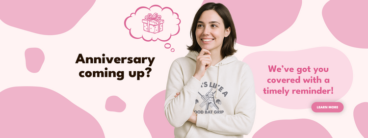 Woman wearing a white hoodie with a graphic design, surrounded by pink shapes and text about an anniversary reminder.