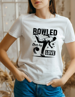 A lady wearing a white t-shirt with Bowled Over by Love on the front. The Ultimate Cricket Banter T-Shirt! Funny Cricket T-Shirt, Premium Fabric, Multiple Adult Sizes