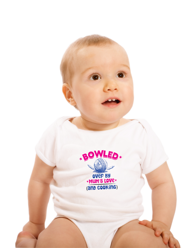 A baby wearing a baby grow with Bowled Over by Mums Love and Cooking, on the front – Funny Cricket Baby Bodysuit, Organic or In-Conversion to Organic Cotton, Self Fabric Bound Neckline, Cuffs and Leg Openings.