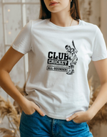 A lady wearing a white t-shirt with Club Cricket: Where Everyone’s An All-rounder on the front. A Funny Cricket T-shirt  Premium Fabric, Multiple Adult Sizes
