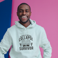 A man wearing a white hoodie with Middle-order Collapse Survivor on the front. A Funny Cricket Hoodie, Premium Fabric, Multiple Adult Sizes