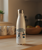 White water bottle with a motivational quote and graphic on a wooden table. This is a Cows Corner water bottle with a funny cricket slogan 'To My Coach Who Made Me Believe in My First Cover Drive – You’re a Legend'. Cows Corner gifts are perfect for sport-mad fans, these gifts work brilliantly for birthdays, new baby celebrations, Father’s Day, Mother’s Day, Christmas, anniversaries, thank you gifts, end-of-season team awards, graduations, retirements, and just-because moments when you want to raise a smile
