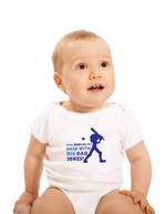 A baby wearing a baby grow with Dad Bowled Me over With His Dad Jokes, on the front! Funny Cricket Baby Bodysuit, Organic or In-Conversion to Organic Cotton, Self Fabric Bound Neckline, Cuffs and Leg Openings