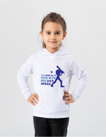 A little girl wearing a white hoodie with Dad Bowled Me Over With His Dad Jokes on the front. A Funny Cricket Hoodie, Premium Fabric, Multiple Junior Sizes, Perfect for Boys and Girls