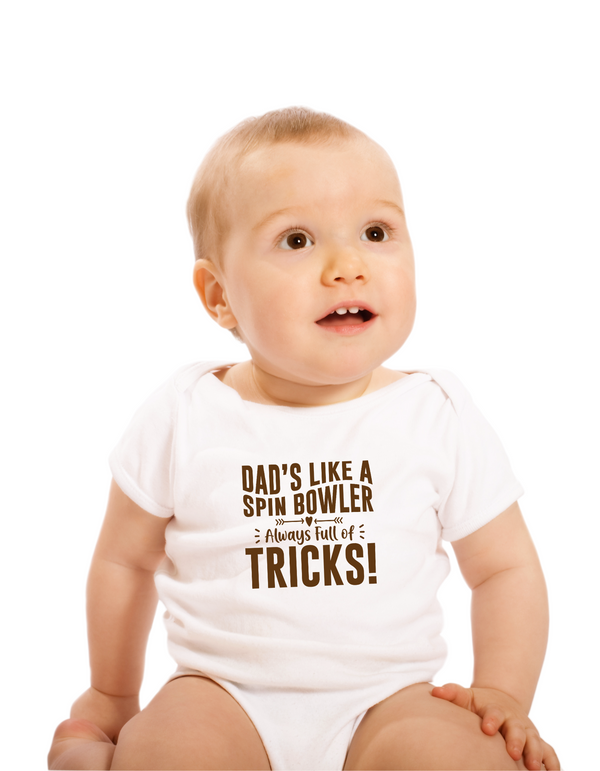 A baby wearing a baby grow with Dads Like a Spin Bowler, Always Full of Tricks, on the front! Funny Cricket Baby Bodysuit, Organic or In-Conversion to Organic Cotton, Self Fabric Bound Neckline, Cuffs and Leg Openings