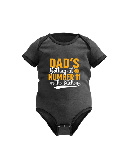 Dad’s Batting at Number 11 in the Kitchen.  Funny Cricket Baby Bodysuit, Organic or In-Conversion to Organic Cotton, Self Fabric Bound Neckline, Cuffs and Leg Openings
