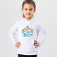 A little girl wearing a white hoodie with Dad Is a Great Fielder, Always Catching Me Out on the front.  A Funny Cricket Hoodie, Premium Fabric, Multiple Junior Sizes, Perfect for Boys and Girls