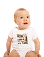 A baby wearing a baby grow with Dad’s Like a Good Yorker, Keeps Me on My Toes, on the front! Funny Cricket Baby Bodysuit, Organic or In-Conversion to Organic Cotton, Self Fabric Bound Neckline, Cuffs and Leg Openings