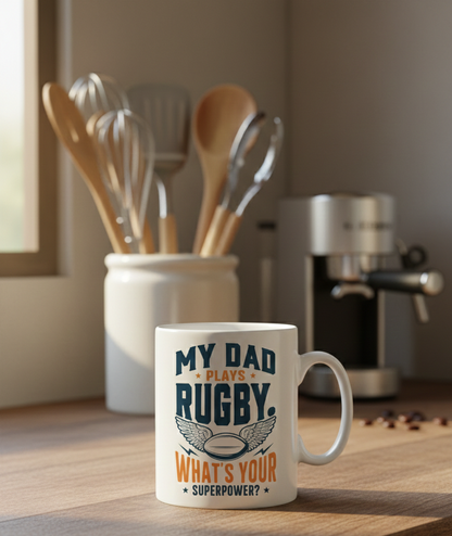 This is a Cows Corner mug with a funny rugby slogan 'My Dad Plays Rugby. What’s Your Superpower?'. Cows Corner gifts are perfect for sport-mad fans, these gifts work brilliantly for birthdays, new baby celebrations, Father’s Day, Mother’s Day, Christmas, anniversaries, thank you gifts, end-of-season team awards, graduations, retirements, and just-because moments when you want to raise a smile. 
