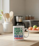 Mug with 'Drive Chip Putt Hug Dad Repeat' text on a kitchen counter. This is a Cows Corner mug - Cows Corner gifts are perfect for sport-mad fans, these gifts work brilliantly for birthdays, new baby celebrations, Father’s Day, Mother’s Day, Christmas, anniversaries, thank you gifts, end-of-season team awards, graduations, retirements, and just-because moments when you want to raise a smile. 
