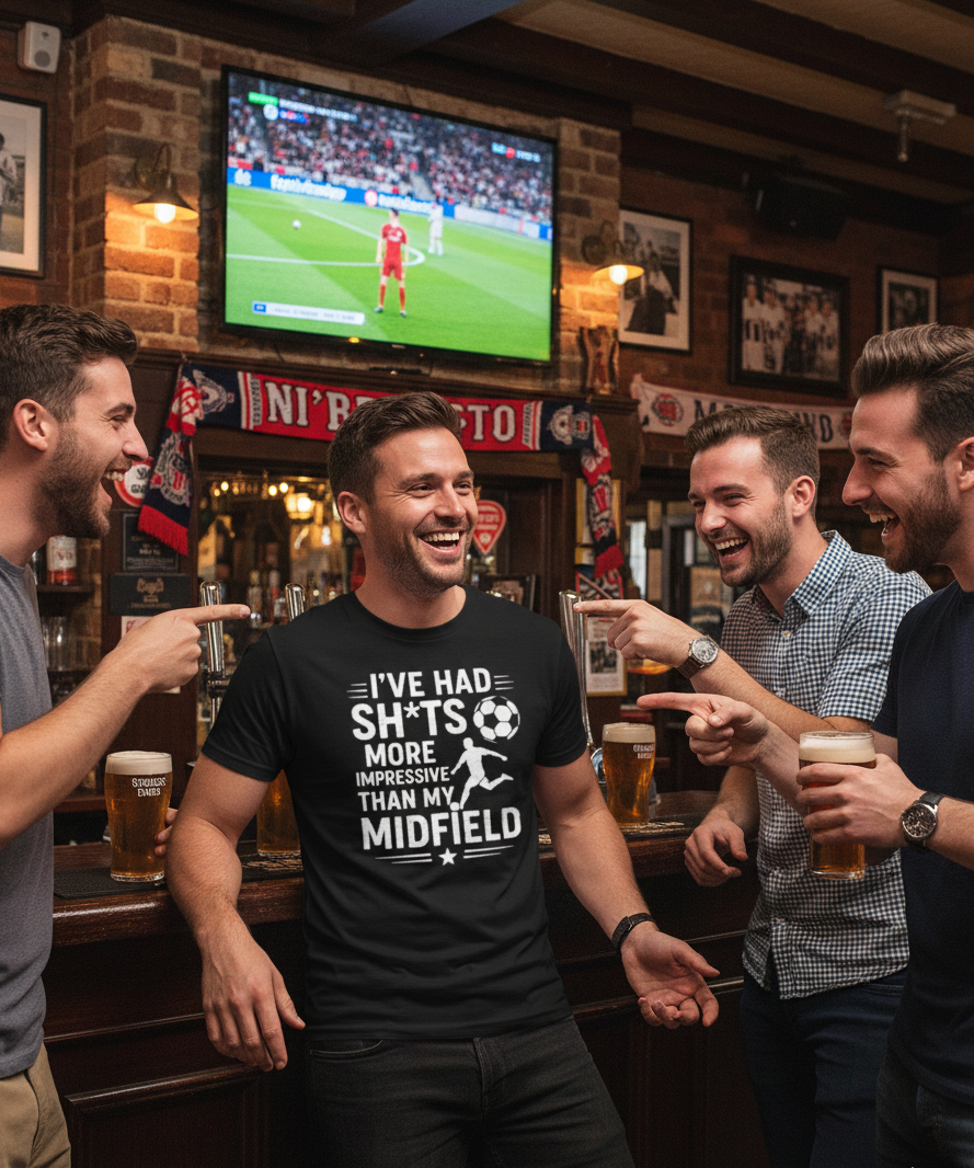 Men in a pub watching sports on TV, one wearing a Cows Corner funny slogan hoodie