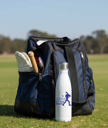 Backpack with cricket gear and a water bottle on a grassy field. This is a Cows Corner water bottle with a funny cricket slogan 'Dad Bowled Me Over With His Dad Jokes'. Cows Corner gifts are perfect for sport-mad fans, these gifts work brilliantly for birthdays, new baby celebrations, Father’s Day, Mother’s Day, Christmas, anniversaries, thank you gifts, end-of-season team awards, graduations, retirements, and just-because moments when you want to raise a smile. 
