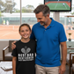 Man and young girl standing together with a TV screen showing a tennis match in the background.  The girl is wearing a Cows Corner T-shirt with funny and sweet tennis slogan on the front that reads 'Best Dad, Best Coach, Best Cheerleader'.  Cows Corner gifts are perfect for sport-mad fans, these gifts work brilliantly for birthdays, new baby celebrations, Father’s Day, Mother’s Day, Christmas, anniversaries, thank you gifts, end-of-season team awards, graduations, retirements, and just-because moments when 