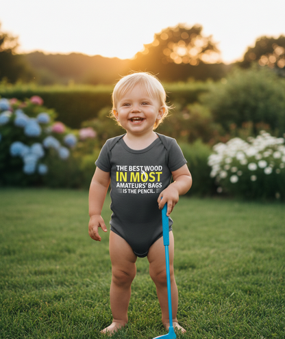 Child wearing a graphic onesie holding a garden tool in a garden setting with flowers and greenery.  The baby is wearing a Cows Corner baby grow with the funny golf slogan 'The Best Wood in Most Amateurs Bags, Is the Pencil'. Cows Corner gifts are perfect for sport-mad fans, these gifts work brilliantly for birthdays, new baby celebrations, Father’s Day, Mother’s Day, Christmas, anniversaries, thank you gifts, end-of-season team awards, graduations, retirements, and just-because moments 