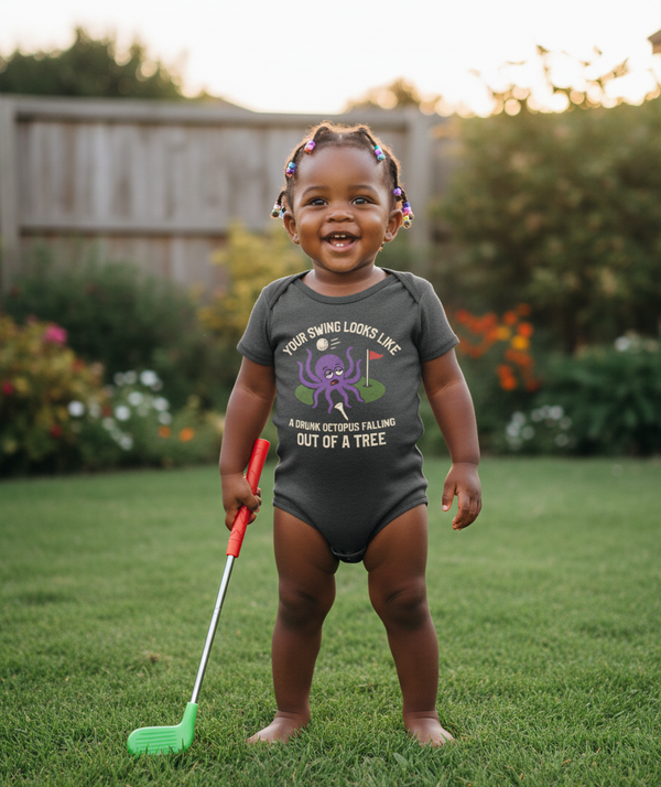 Child in a garden wearing a onesie with text and holding a toy golf club. The baby is wearing a Cows Corner baby grow with a funny golf slogan 'Your Swing Looks Like a Drunk Octopus Falling out of a Tree'. Cows Corner gifts are perfect for sport-mad fans, these gifts work brilliantly for birthdays, new baby celebrations, Father’s Day, Mother’s Day, Christmas, anniversaries, thank you gifts, end-of-season team awards, graduations, retirements, and just-because moments when you want to raise a smile. 
