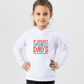 A little girl wearing a white hoodie with If Cricket Is Life, Then Dad's The Groundskeeper on the front. A Funny Cricket Hoodie, Premium Fabric, Multiple Junior Sizes, Perfect for Boys and Girls