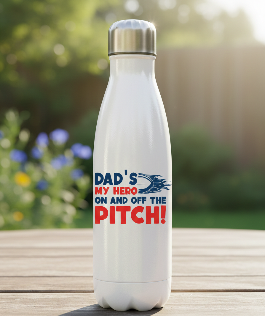 White water bottle with a motivational quote on a wooden surface with a blurred natural background. This is a Cows Corner water bottle with a funny rugby slogan 'Dad’s My Hero on and off the Pitch!'. Cows Corner gifts are perfect for sport-mad fans, these gifts work brilliantly for birthdays, new baby celebrations, Father’s Day, Mother’s Day, Christmas, anniversaries, thank you gifts, end-of-season team awards, graduations, retirements, and just-because moments when you want to raise a smile. 

