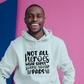 A man wearing a white hoodie with Not All Heroes Wear Capes, Some Wear Pads on the front. A Funny Cricket Hoodie, Premium Fabric, Multiple Adult Sizes