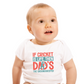 A baby wearing a baby grow with If Cricket Is Live, Then Dad’s the Groundskeeper on the front! Funny Cricket Baby Bodysuit, Organic or In-Conversion to Organic Cotton, Self Fabric Bound Neckline, Cuffs and Leg Openings