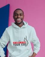 A man wearing a white hoodie with the funny tennis slogan on the front that reads 'Shh....i'm About To Ace Your Ego'