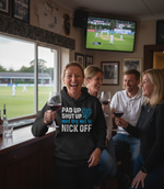 The lady is wearing a Cows Corner hoodie with the funny cricket slogan that reads 'Pad Up, Shut Up And Try Not To Nick Off'.  Cows Corner gifts are perfect for sport-mad fans, these gifts work brilliantly for birthdays, new baby celebrations, Father’s Day, Mother’s Day, Christmas, anniversaries, thank you gifts, end-of-season team awards, graduations, retirements, and just-because moments when you want to raise a smile. 
