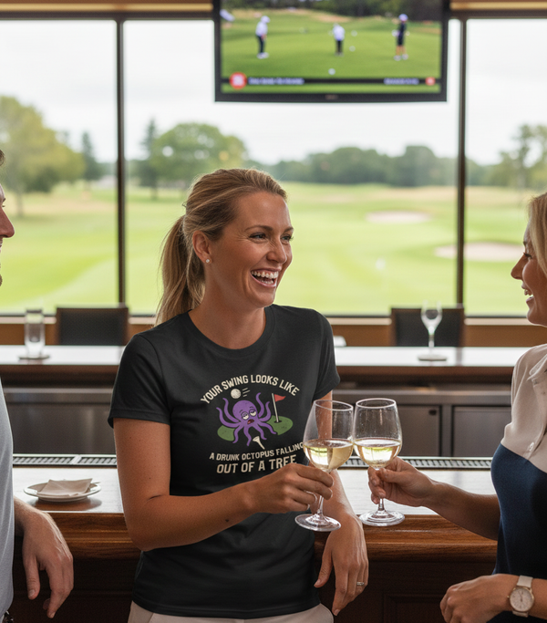 People enjoying drinks and conversation in a bar with a golf course view. The man is wearing a Cows Corner t-shirt with a funny golf slogan on the front that reads 'Your Swing Looks Like a Drunk Octopus Falling out of a Tree'. Cows Corner gifts are perfect for sport-mad fans, these gifts work brilliantly for birthdays, new baby celebrations, Father’s Day, Mother’s Day, Christmas, anniversaries, thank you gifts, end-of-season team awards, graduations, retirements, and just-because moments 