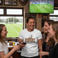 Group of women in a pub watching a rugby match on TV, one wearing a 'Rugby Because Punching' shirt. The lady is wearing a Cows Corner t-shirt with the funny golf slogan on the front that reads 'Rugby Because Punching People in Public Is Frowned Upon'. Cows Corner gifts are perfect for sport-mad fans, these gifts work brilliantly for birthdays, new baby celebrations, Father’s Day, Mother’s Day, Christmas, anniversaries, thank you gifts, end-of-season team awards, graduations, retirements, and just-because