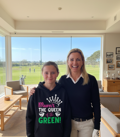 Two people standing in a room with large windows overlooking a golf course. The girl is wearing a Cows Corner hoodie with a funny golf slogan 'Mum’s the Queen of the Green'. Cows Corner gifts are perfect for sport-mad fans, these gifts work brilliantly for birthdays, new baby celebrations, Father’s Day, Mother’s Day, Christmas, anniversaries, thank you gifts, end-of-season team awards, graduations, retirements, and just-because moments when you want to raise a smile. 
