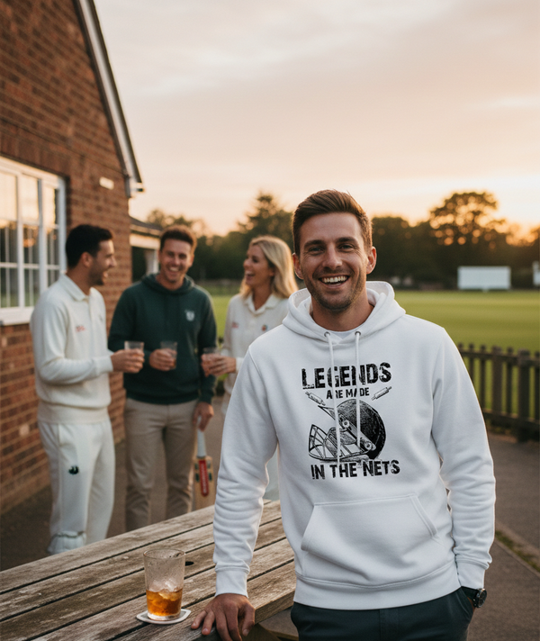 Man wearing a Cows Corner hoodie with 'Legends Are Made In The Nets' text, standing outdoors with friends. Cows Corner gifts are perfect for sport-mad fans, these gifts work brilliantly for birthdays, new baby celebrations, Father’s Day, Mother’s Day, Christmas, anniversaries, thank you gifts, end-of-season team awards, graduations, retirements, and just-because moments when you want to raise a smile. 
