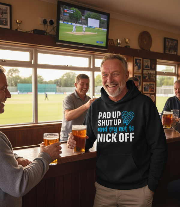 People in a pub watching cricket on TV with a man in a hoodie with humorous text. The man is wearing a Cows Corner hoodie with the funny cricket slogan that reads 'Pad Up, Shut Up And Try Not To Nick Off'. Cows Corner gifts are perfect for sport-mad fans, these gifts work brilliantly for birthdays, new baby celebrations, Father’s Day, Mother’s Day, Christmas, anniversaries, thank you gifts, end-of-season team awards, graduations, retirements, and just-because moments when you want to raise a smile. 
