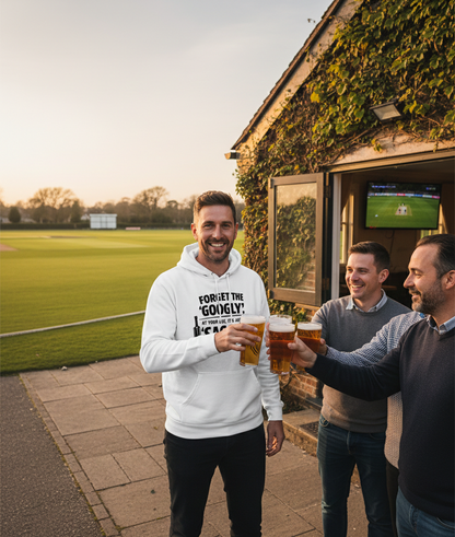 Three men enjoying beers outside a pub with a sports game on the screen. The man is wearing a Cows Corner hoodie with the funny cricket birthday slogan 'Forget the 'Googly', at your age, it’s just a 'Saggy''. Cows Corner gifts are perfect for sport-mad fans, these gifts work brilliantly for birthdays, new baby celebrations, Father’s Day, Mother’s Day, Christmas, anniversaries, thank you gifts, end-of-season team awards, graduations, retirements, and just-because moments when you want to raise a smile. 
