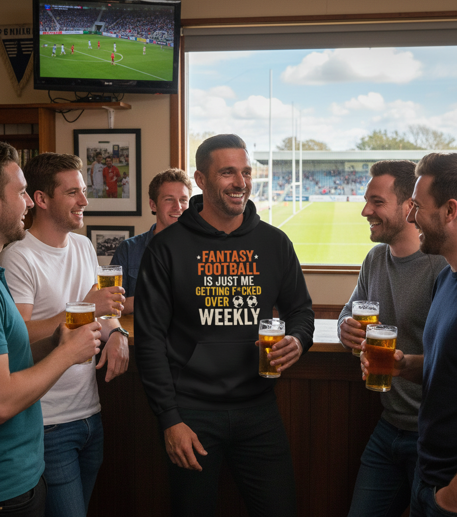 Group of men in a sports bar watching a game on TV and drinking beer.  The man is wearing a Cows Corner hoodie with the funny fantasy football slogan on the front that reads 'Fantasy Football Is Just Me Getting F*cked Over Weekly'.  Cows Corner gifts are perfect for sport-mad fans, these gifts work brilliantly for birthdays, new baby celebrations, Father’s Day, Mother’s Day, Christmas, anniversaries, thank you gifts, end-of-season team awards, graduations, retirements, and just-because moments 