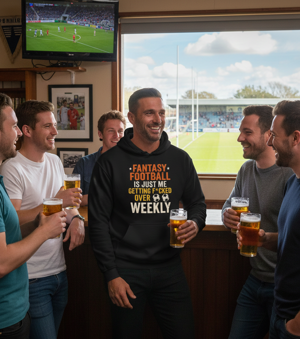 Group of men in a sports bar watching a game on TV and drinking beer.  The man is wearing a Cows Corner hoodie with the funny fantasy football slogan on the front that reads 'Fantasy Football Is Just Me Getting F*cked Over Weekly'.  Cows Corner gifts are perfect for sport-mad fans, these gifts work brilliantly for birthdays, new baby celebrations, Father’s Day, Mother’s Day, Christmas, anniversaries, thank you gifts, end-of-season team awards, graduations, retirements, and just-because moments 