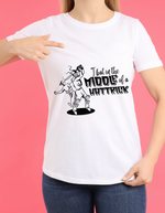 A lady wearing a white t-shirt with "I Bat In The Middle Of A Hattrick" A Funny Cricket T-shirt, Premium Fabric, Multiple Adult Sizes