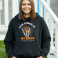 A lady wearing a black hoodie with Stop Looking at My Middle Stump on the front. A Funny Cricket Hoodie, Premium Fabric, Multiple Adult Sizes