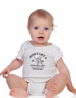 A baby wearing the baby grow with Mums Like a Good Bat Grip, Always Holding Things Together - on the front! Funny Cricket Baby Bodysuit, Organic or In-Conversion to Organic Cotton, Self Fabric Bound Neckline, Cuffs and Leg Openings