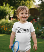 Child wearing a white onesie with text, holding a blue tennis racket in a garden setting. The baby is wearing a Cows Corner baby grow with a funny tennis slogan 'Mum Serves Up Love and Aces'. Cows Corner gifts are perfect for sport-mad fans, these gifts work brilliantly for birthdays, new baby celebrations, Father’s Day, Mother’s Day, Christmas, anniversaries, thank you gifts, end-of-season team awards, graduations, retirements, and just-because moments when you want to raise a smile. 

