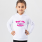 A little girl wearing a white hoodie with Mum’s My Umpire, Always Raising Me Right on the front. A Funny Cricket Hoodie, Premium Fabric, Multiple Junior Sizes, Perfect for Boys and Girls