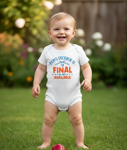 Baby in a garden wearing a onesie with humorous text. The baby is wearing a Cows Corner baby grow with a funny cricket slogan 'Mum’s Decision is Final – No DRS Available'.  Cows Corner gifts are perfect for sport-mad fans, these gifts work brilliantly for birthdays, new baby celebrations, Father’s Day, Mother’s Day, Christmas, anniversaries, thank you gifts, end-of-season team awards, graduations, retirements, and just-because moments when you want to raise a smile. 
