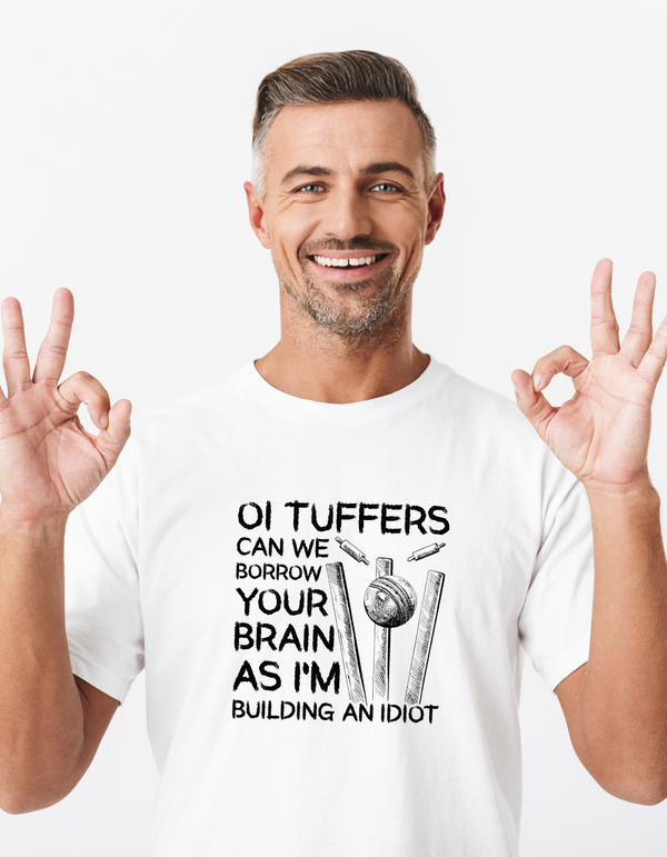 A man wearing a white t-shirt with Oi Tuffers, Can We Borrow Your Brain on the front. A Funny Cricket T-shirt, Premium Fabric, Multiple Adult Sizes