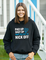 A lady wearing a black hoodie with Pad Up, Shut Up and Try Not to Nick Off on the front! A Funny Cricket Hoodie, Premium Fabric, Multiple Adult Sizes