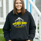 A lady wearing a black hoodie with I Like My Pitches Hard and My Balls Shiny on the front! A Funny Cricket Hoodie, Premium Fabric, Multiple Adult Sizes