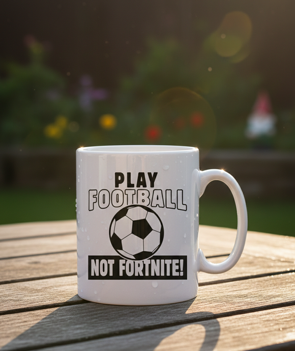 This is a Cows Corner mug with a funny football slogan 'Play Football Not Fortnite!'. Cows Corner gifts are perfect for sport-mad fans, these gifts work brilliantly for birthdays, new baby celebrations, Father’s Day, Mother’s Day, Christmas, anniversaries, thank you gifts, end-of-season team awards, graduations, retirements, and just-because moments when you want to raise a smile. 
