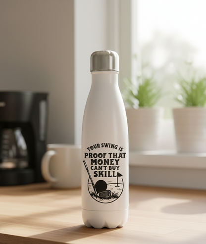 White water bottle with motivational quote on a wooden surface. This is a Cows Corner water bottle with a funny golf slogan 'Your Swing Is Proof That Money Can’t Buy Skill'. Cows Corner gifts are perfect for sport-mad fans, these gifts work brilliantly for birthdays, new baby celebrations, Father’s Day, Mother’s Day, Christmas, anniversaries, thank you gifts, end-of-season team awards, graduations, retirements, and just-because moments when you want to raise a smile. 
