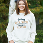 A lady wearing a white hoodie with Swing both ways, on the front. Only if it's reverse!  Funny Cricket Hoodie, Premium Fabric, Multiple Adult Sizes