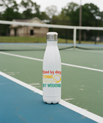 White water bottle with colorful text on a tennis court. This is a Cows Corner water bottle with the funny cricket slogan 'Dad By Day, Tennis Champ By Weekend'. Cows Corner gifts are perfect for sport-mad fans, these gifts work brilliantly for birthdays, new baby celebrations, Father’s Day, Mother’s Day, Christmas, anniversaries, thank you gifts, end-of-season team awards, graduations, retirements, and just-because moments when you want to raise a smile. 
