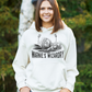 A lady wearing a white hoodie with Warne’s Wizardry on the front!  Funny Cricket Hoodie, Premium Fabric, Multiple Adult Sizes